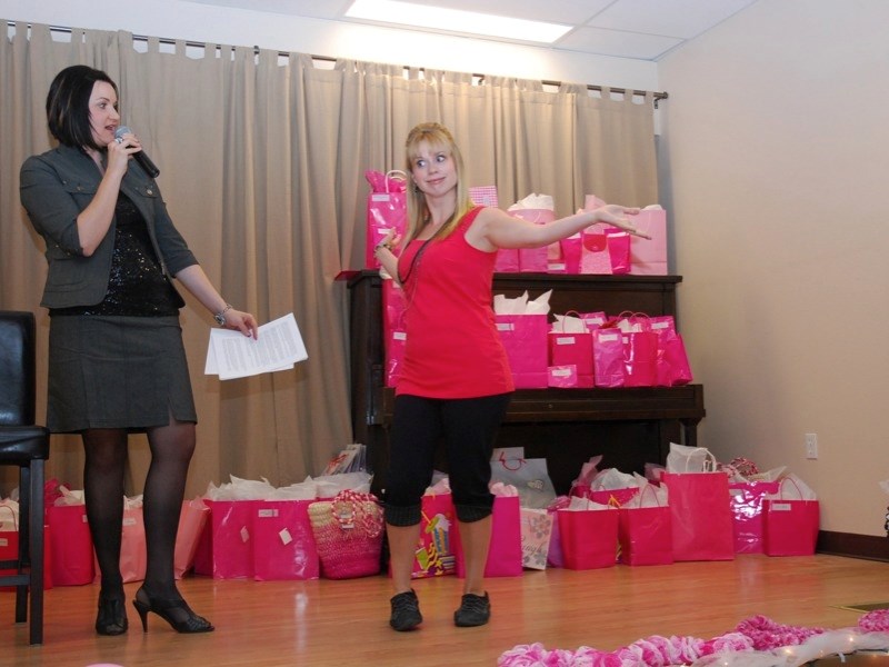 Last year&#8217;s Road to Hope Fashion Show Fundraiser raised approximately $3,800 for the nonprofit. (l –r) Principal organizer Annie Syryda emcees the 2012 event while a