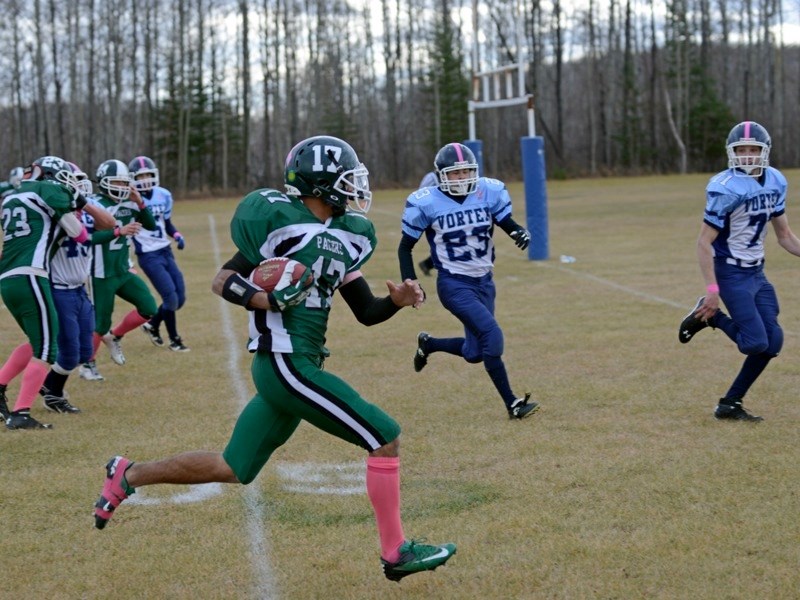 Gaetano Minto heads for the touchdown line as a Vegreville player approaches.