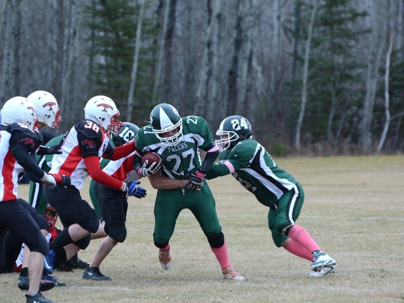 The EPC Pacers won the Wheatland Football League tier two championship 34-30 last Saturday at EPC. Nolan Anderson (#27) powers past three T-Birds as Mitchell Snow (#24) fends 