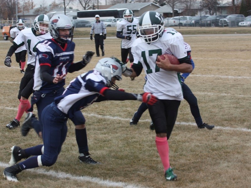 Gaetano Minto was tackled by the Bonnyville Voyageurs during the Pacers game last Saturday for the Consolation Cup.