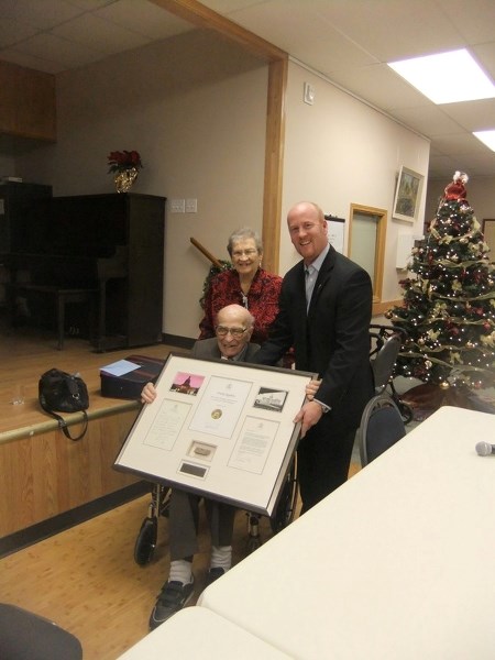 Former Athabasca MLA Frank Appleby, accompanied by his wife, Dorothy, received a piece of the legislature in which he once sat from current Athabasca-Sturgeon-Redwater MLA