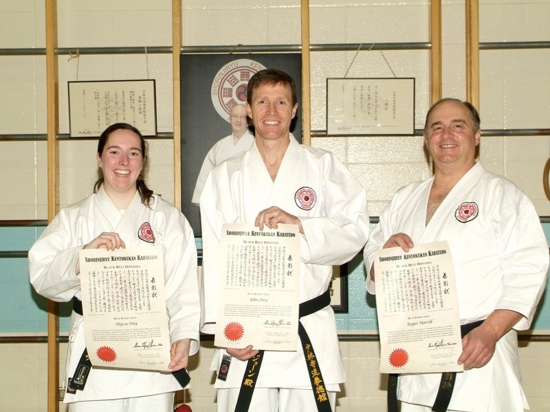 (l-r) Athabasca Wa-no Kaze Kai Karate Club members Alyssa Day (second-degree black belt), John Day (third-degree black belt) and Roger Morrill (third-degree black belt) hold