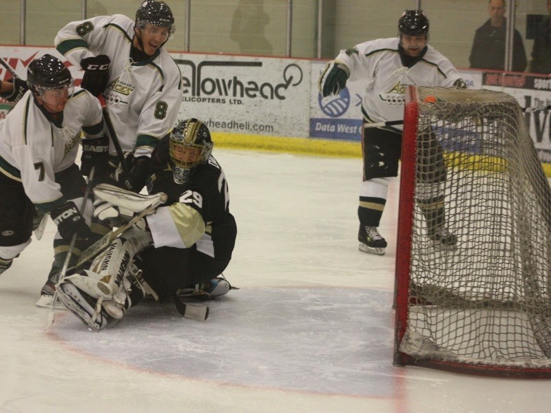 Keith Reade (#7) scores one of his two goals on the Devon Barons last Saturday at the Athabasca Regional Multiplex with Gerald Desjarlais (#8) and Brent Hill (#24) close at