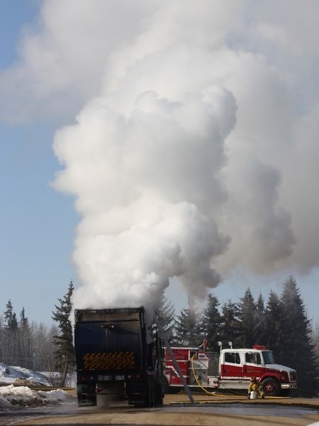Athabasca firefighters worked for more than two hours to put out a fire contained in the hull of a garbage truck near LTIS Tuesday morning.