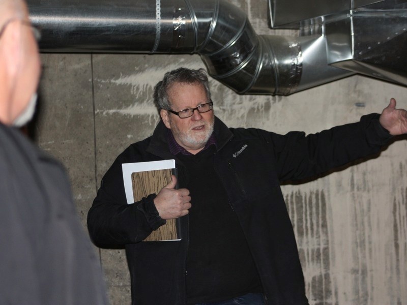 Mike Gismondi, vice-chair of the Athabasca Heritage Society, tours people through the basement of the train station. The society hosted an open house on March 29 to showcase