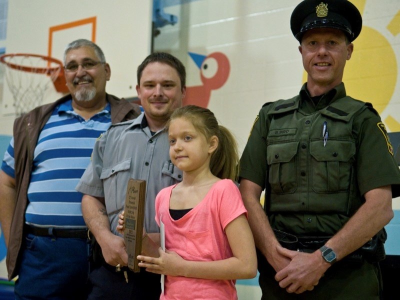 Boyle Rural Crime Watch often takes part in presenting awards to local students who have won Crime Watch poster contests. (l-r) Terry Jordan from Boyle Crime Watch, Athabasca 