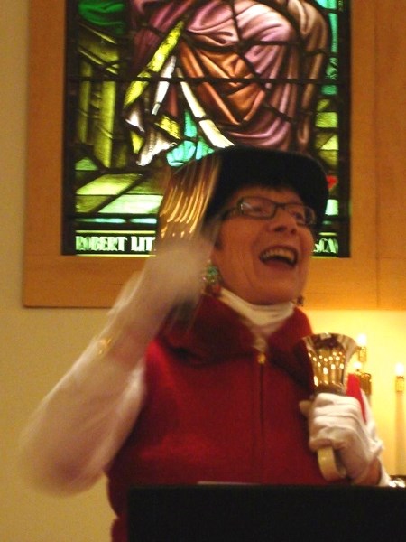 Lois Demcoe, a member of the Athabasca Community Handbell Choir, performs last Christmas. The community choir will play with the JUBILOSO! Bells of Concordia group this
