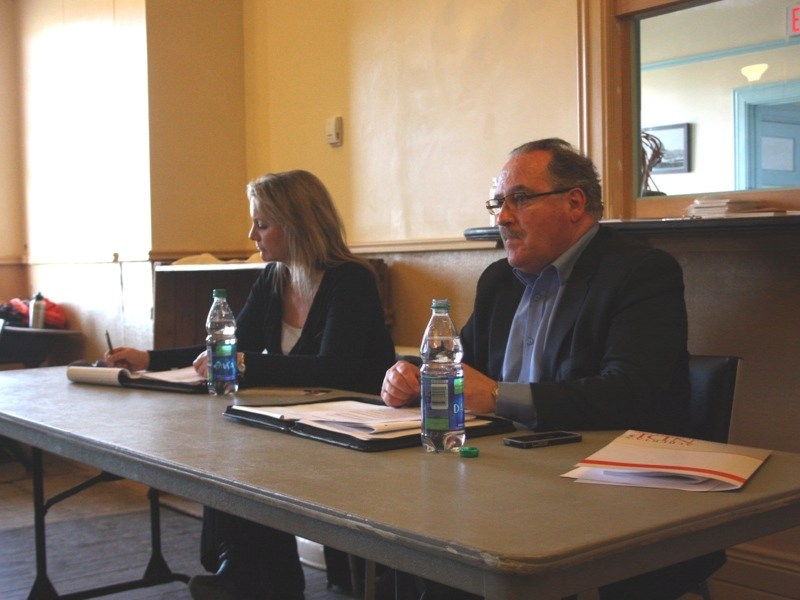 Federal NDP byelection candidate Lori McDaniel and provincial NDP leader Brian Mason listen to questions from the floor during an NDP town hall on proposed pension changes