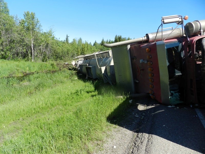 Two tankers being hauled by a semi that rolled into a Highway 831 ditch on Sunday ruptured and spilled oil approximately 15 kilometres south of Boyle.