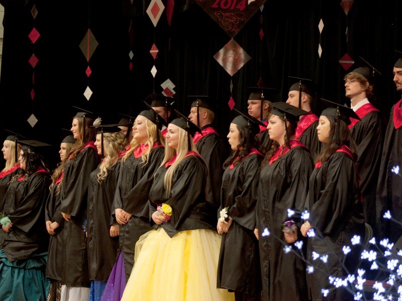 The Boyle School graduating class of 2014 stands before friends and family during the grad ceremony on July 5. (front row, l-r) Carly Sawchuk, Meaghan Bohay, Shania Whitford, 