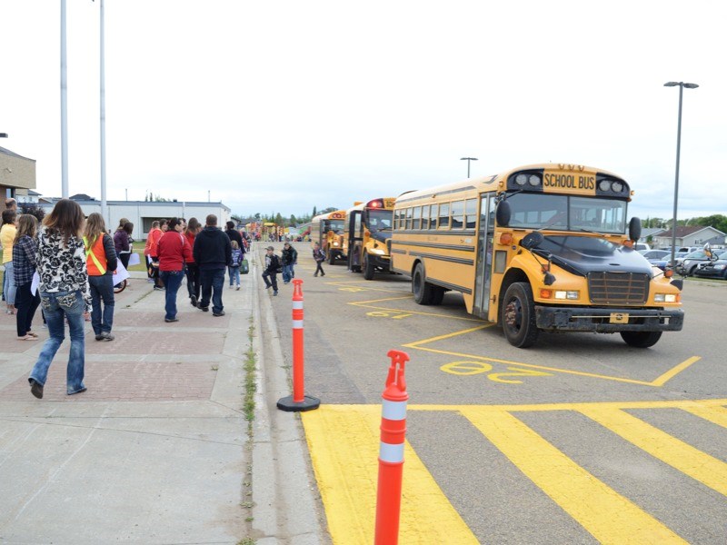 School bus after school bus pull into the drop-off loop at Whispering Hills Primary School last Tuesday filled with students dressed to the nines for the first day of a new