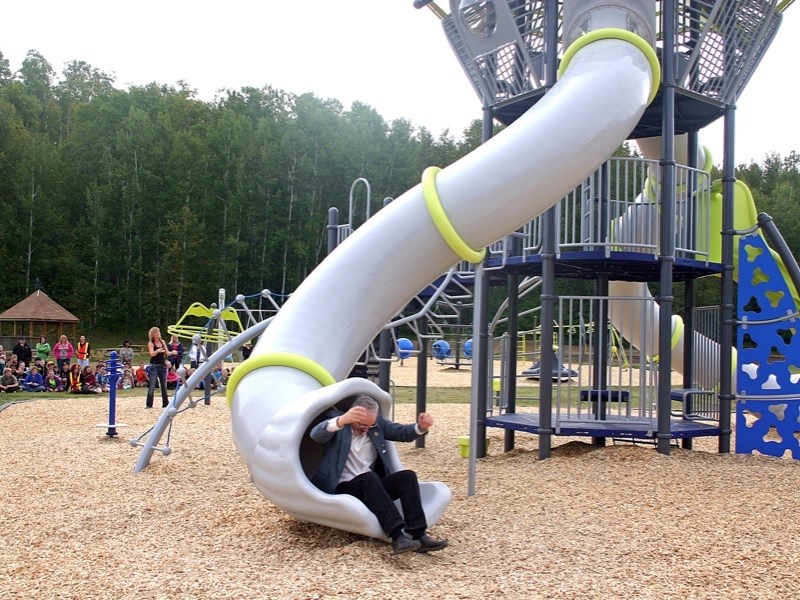 Dennis MacNeil, board chair of Aspen View Public Schools, &#8220;inaugurates” the new playground.
