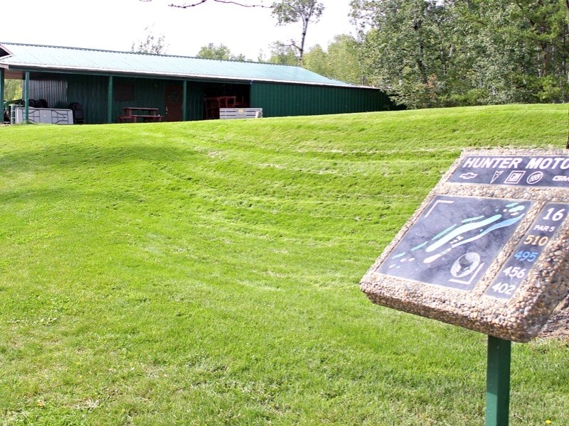 According to the survey stakes, the new bridge will be built on the north side of the current bridge with the highway being routed just behind the maintenance shed at the top 