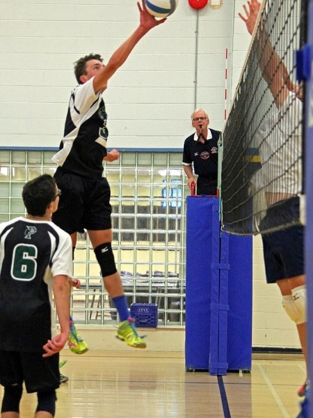 EPC Predator Max Elgert (3) goes high on a middle attack against a blocker from Barrhead Composite Gryphons as Evan Kaminski (6) watches during their &#8216;A&#8217; side