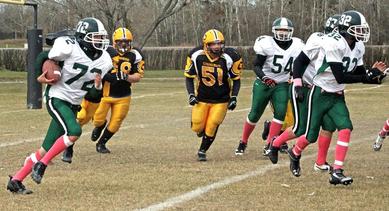 Trent Chamberlain (72) carries the ball for the Athabasca Pacers deep in their own territory and follows his blockers for what turned out to be close to a 70-yard gain during 