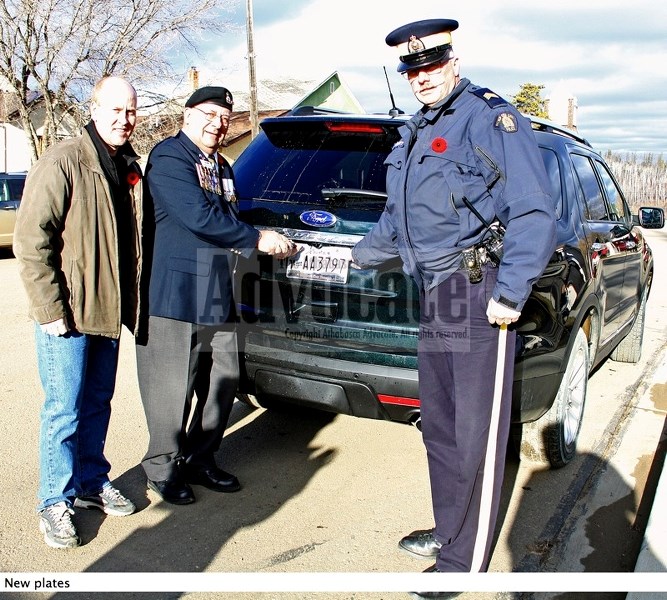 (l-r) Jeff Johnson, Minister of Seniors and MLA for Athabasca-Sturgeon-Redwater, has Athabasca Royal Canadian Legion Branch 103 second vice president John Poynter and