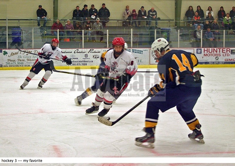 North Central Bulls Tyson Tymo (16) eyes up the puck and lines up the St. Albert player during play in the first period Saturday night at the Multiplex. Unfortunately for the 