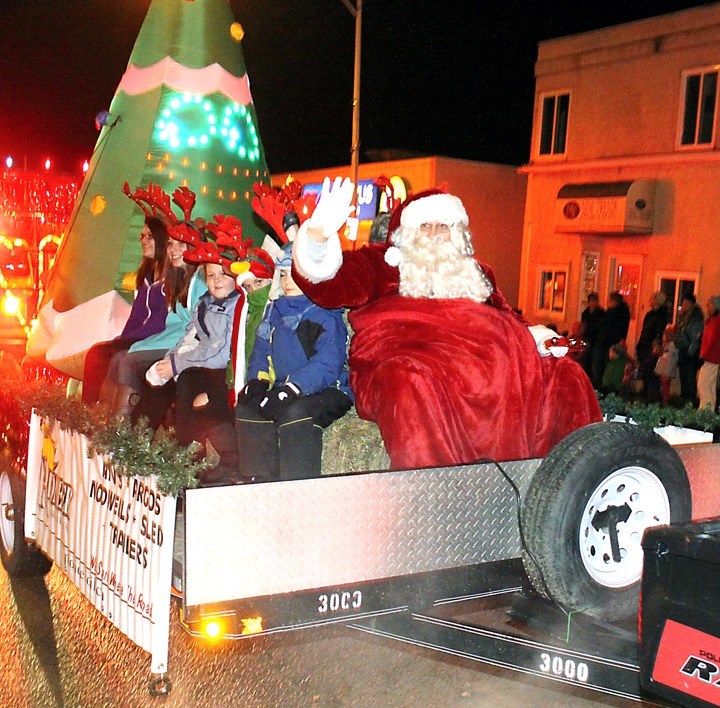 Santa Claus, along with some reindeer, take a ride through downtown Athabasca last Friday night as part of the Athabasca District Chamber of Commerce Moonlight Madness