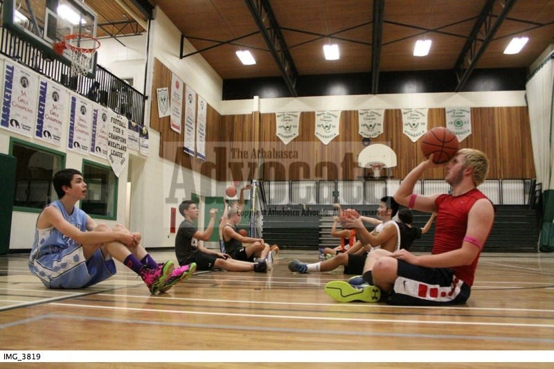 The senior boys basketball team at EPC go through a shooting practice drill.