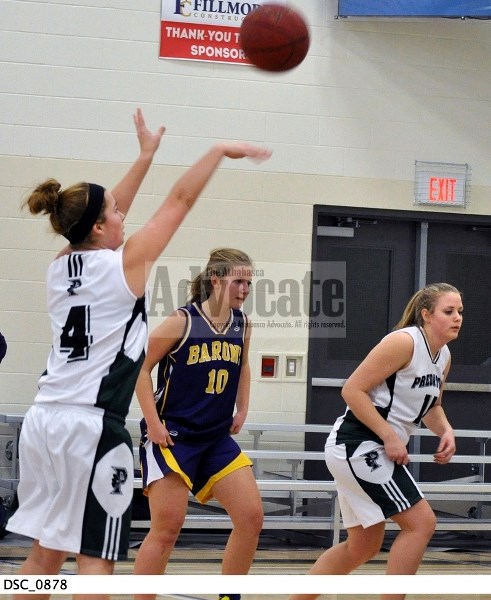 EPC&#8217;s Brianna Kennedy (4) let a foul shot goes as Taylor Garratt (11) gets ready to go for a possible rebound.