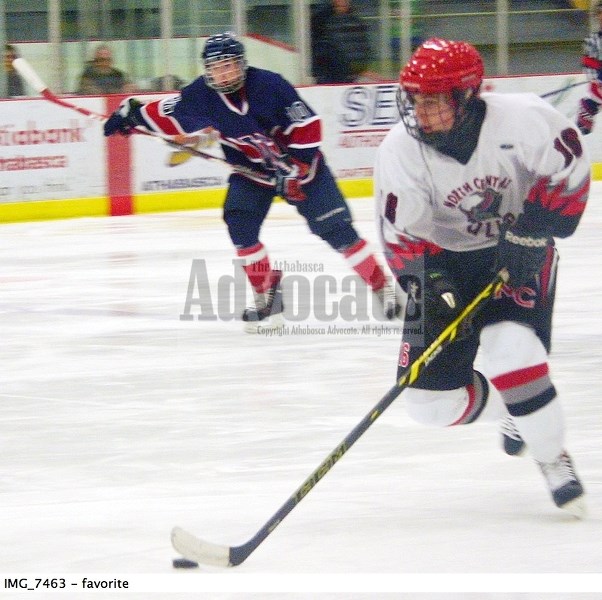Tyson Tymo rushes the puck into the Wetaskiwn zone for the North Central Bulls early in the second period at the Multiplex on Saturday night. While the Bulls played well for