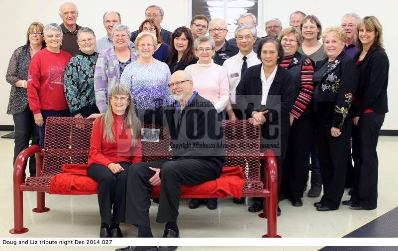 Liz and Doug Madsen sit on the bench marked with a special plaque in honour of the pair&#8217;s dedication and service to the community through their business dealings and