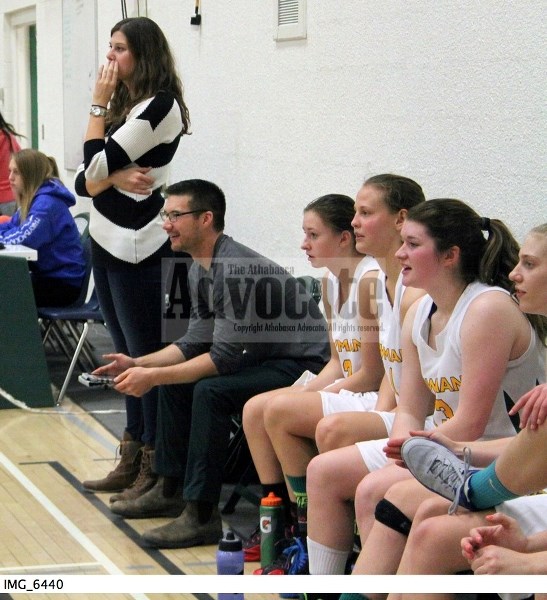 Kiselyk and the rest of her team watch the action during one of their games at the annual EPC Invitational senior high basketball tournament earlier this month.