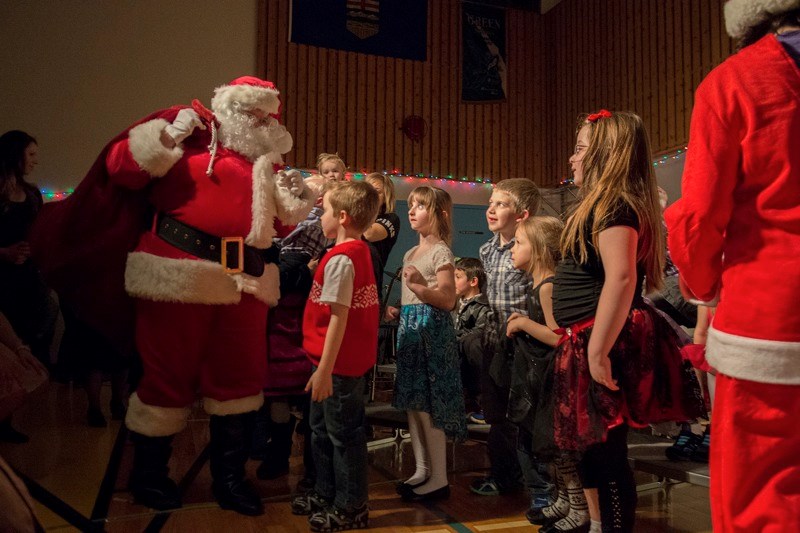 Santa Claus showed up with a bag filled with gifts at the Smith School Christmas concert on Dec. 18, which meant a big line up of children to see the cheerful fellow.