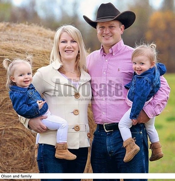 Travis Olson, shown with his wife and twin daughters, remains committed to the Wildrose Party and is utterly disappointed with former leader Danielle Smith.