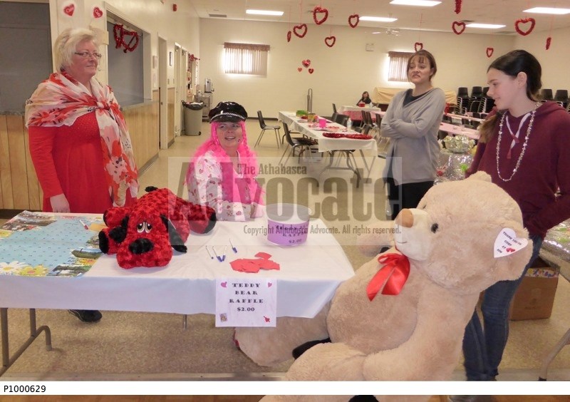 Volunteers look to sell tickets for various raffle items including a pair of stuffed toys last year. This year&#8217;s event will look to do just as well in raising funds for 