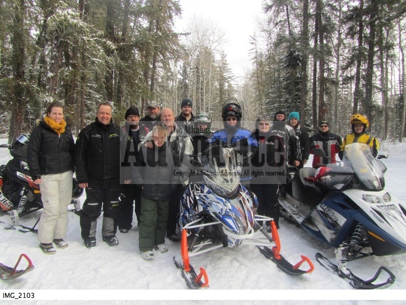 The group of riders that participated in the media day ride last Tuesday hosted by the Athabasca River Runners Snowmobile Club take the opportunity for a rest to pose for a