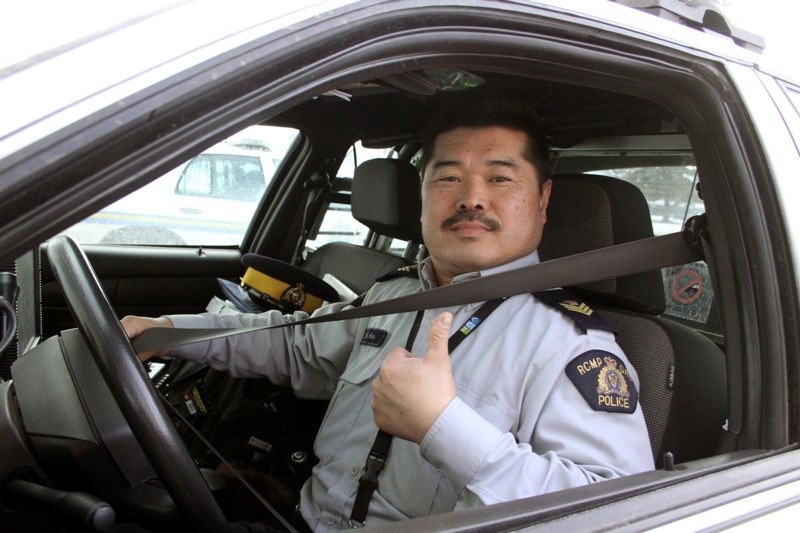 Sgt. Sonny Kim of the Athabasca/Boyle Integrated Traffic Unit demonstrates how to correctly put on a seatbelt. This month, police will be cracking down on those that are not