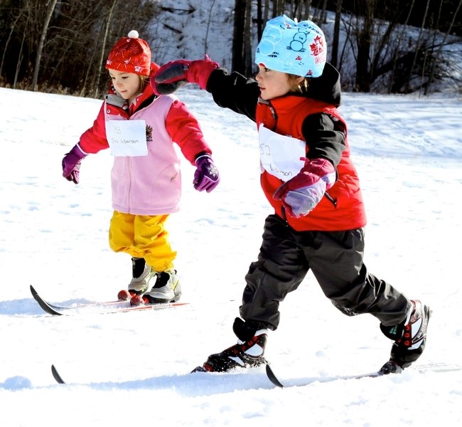 Emma (l) and Ben Giberson keep up with each during the Pre-school glide held last Tuesday as part of the Aspen View Regional Cross Country event at Landing Trail Intermediate 