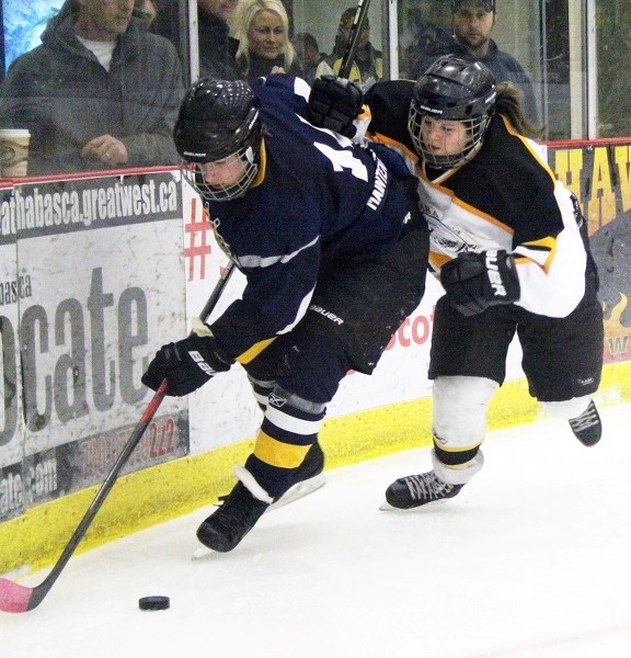 Hawks Larissa Tangedal goes hard on the forecheck during second period play and would win the turnover for the puck eventually.
