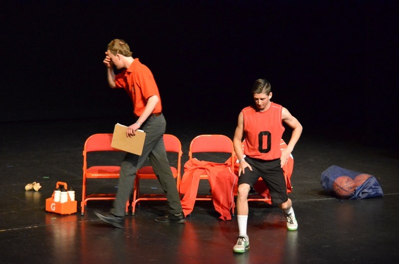 Coach, played by Trent Rosa (l), shakes his head at the thought of Jaimie Krebs (Jordan Sawaka, r) playing in the last few minutes of the game, during a rehearsal for the One 