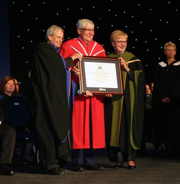 Former Alberta Premier Dave Hancock (c) is presented with an honourary Doctor of Laws by AU Interim President Peter MacKinnon and Board of Governors acting chair Margaret