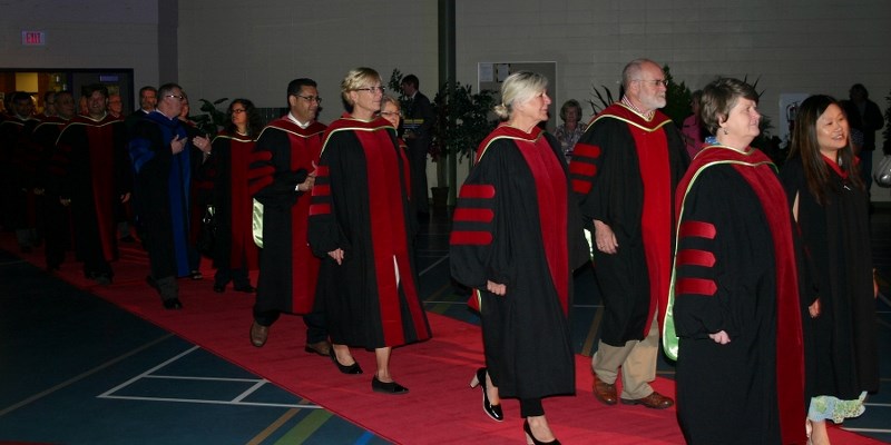 Members of Athabasca University&#8217;s faculty file into the Athabasca Regional Multiplex Saturday for the last of three convocation ceremonies last week.