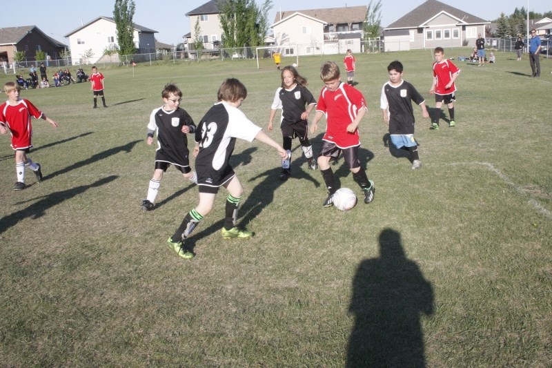 In a game earlier this season, Adyn Jardine of the Athabasca U10 Spartans is surrounded by Athabasca U10 Red Bulls (l-r) Ace Olson, Will Couturier, Brilynn Nahorney and Bartu 