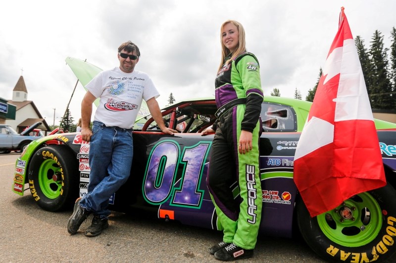 (07/01/15) Shania LaForce and her father Dennis show off their stock car at the classic car show in Athabasca. LaForce will be using this same car for the Candadian Tire