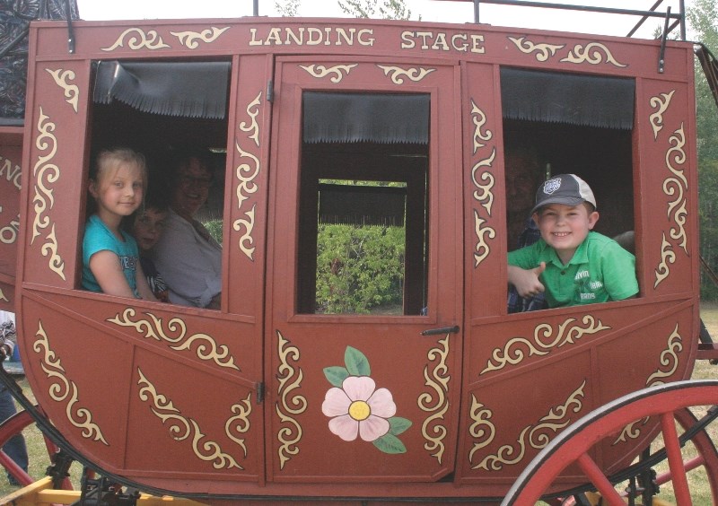 Sophia Kornatska and Declan McKenzie took a ride in a stage coach with their family during Saturday&#8217;s festivities.