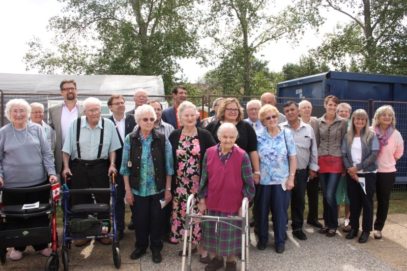Residents at Wildrose Villa seniors lodge and government officials are all smiles as they celebrate construction of new seniors housing on July 15.