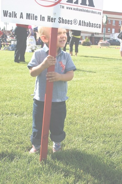 Two-year-old Scott Weppler strutted his stuff at Athabasca&#8217;s fifth annual Walk a Mile in Her Shoes. He was the youngest of the over 30 guys who walked around the