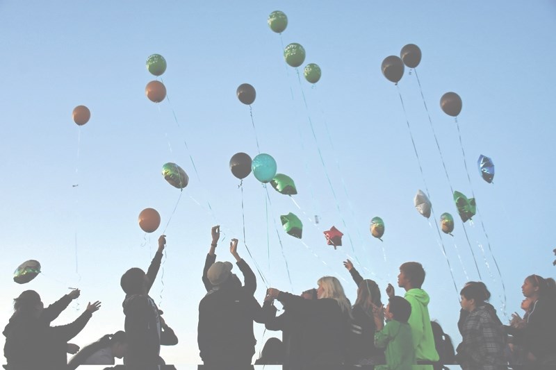 Balloons are set free at the Athabasca skate park on Sept. 17 to mark what would have been Lee Thunder&#8217;s 13th birthday. It was also the six-month anniversary since the