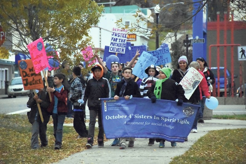 Children march on in memory of missing and murdered aboriginal women at the annual Sister in Spirit walk in Athabasca on Oct. 2.