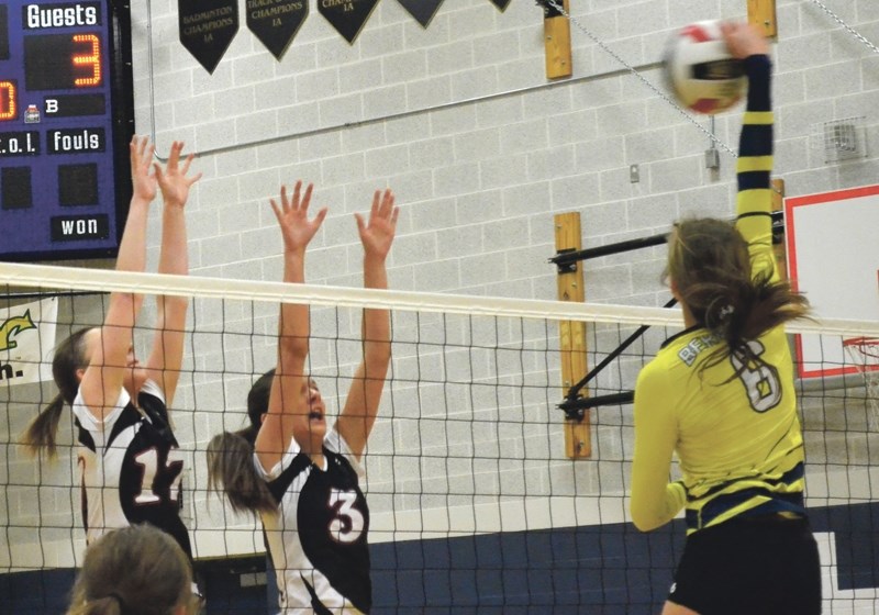 Boyle Huskies Maria Antal and Shelby Bencharsky put up a block against Grassland Cougars Mariah Bereziuk in the semifinal of the zone 1A tournament in Hinton. Boyle beat