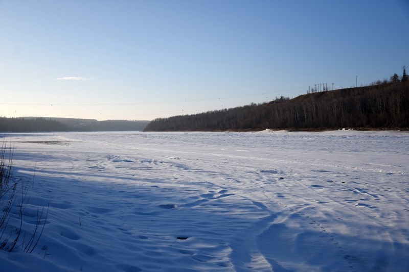 Police are warning that the ice on the Athabasca River is thinning due to the warmer weather.
