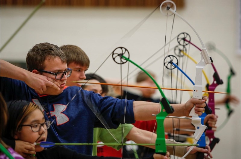 EPC archers practicing their skills in the EPC gym.