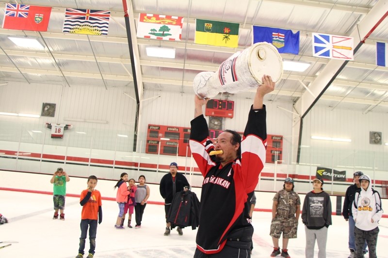 Handsome Devil&#8217;s assistant captain Sheldon Young does a victory lap with the Bannock Cup.