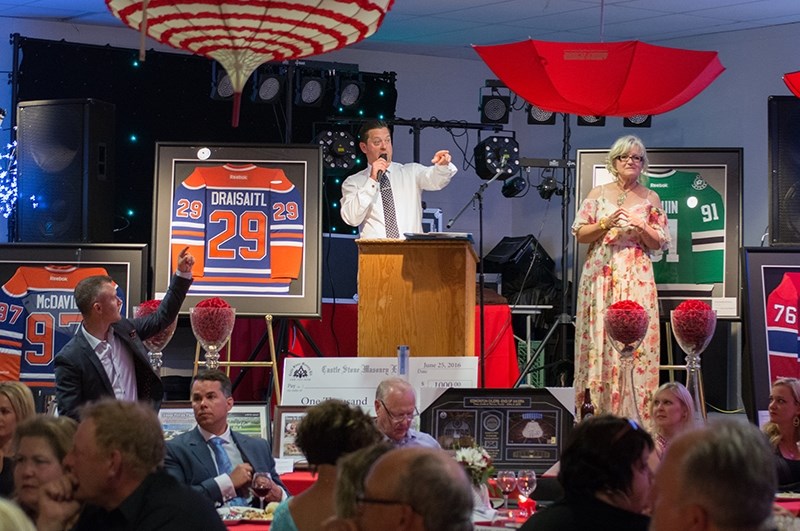 TSN broadcaster and cancer survivor Bryan Mudryk, from Boyle, looks for bids at the Boyle &#038; District Community Centre on Saturday. Mudryk was back in the village for his 
