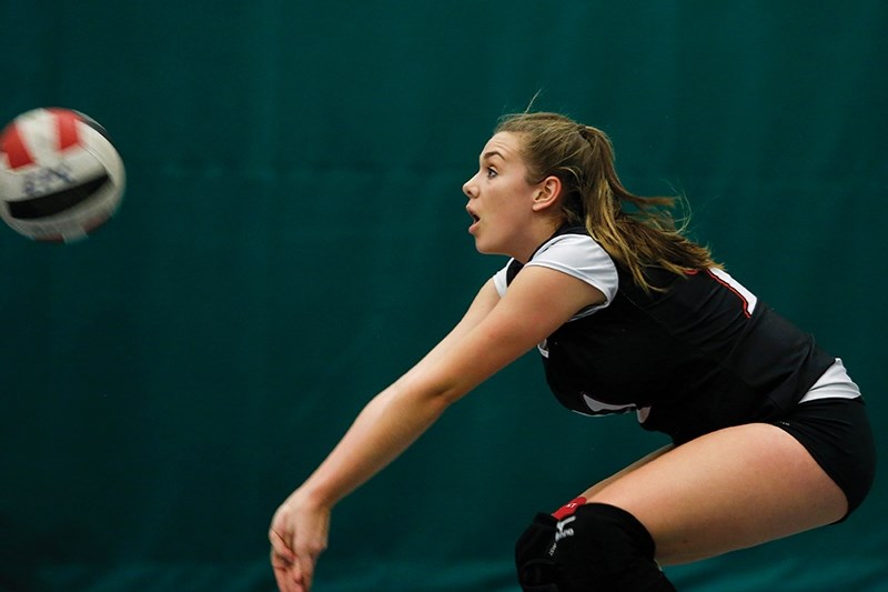 Boyle School&#8217;s Madison Graham digs for the ball during the Huskies&#8217; match against Thorsby.